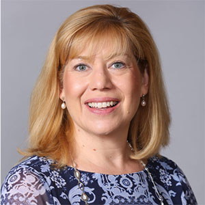 Angie Kronenberg speaking at Broadband Communities Summit