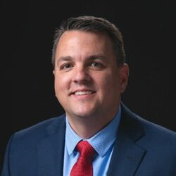 Travis Hill speaking at EV Charging Summit, Las Vegas